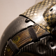 The snakeskin-looking band houses the cables that connect the helmet’s processor and sensors to the aircraft.